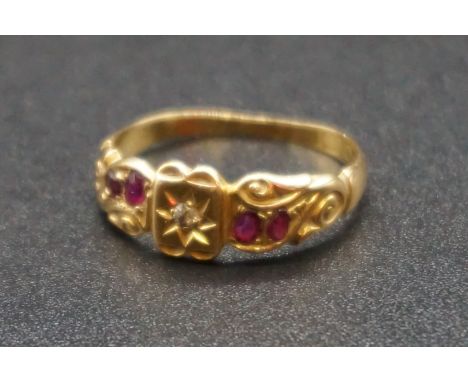 An 18ct gold ruby and diamond gypsy ring, size M 1/2, gross weight 2.3g. 