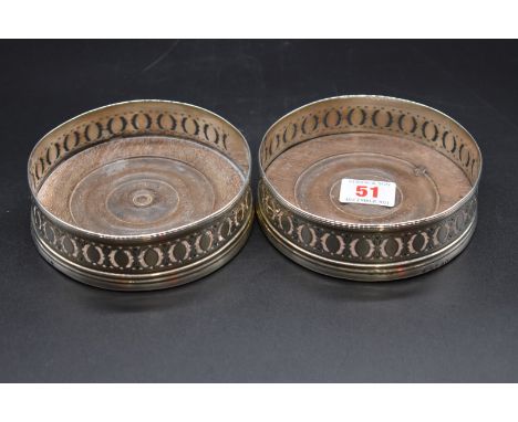 A pair of George III silver wine coasters, by P R? London 1794, 13cm diameter. 