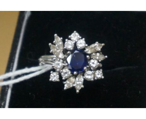 A white metal sapphire and diamond cluster ring, size L-M. 