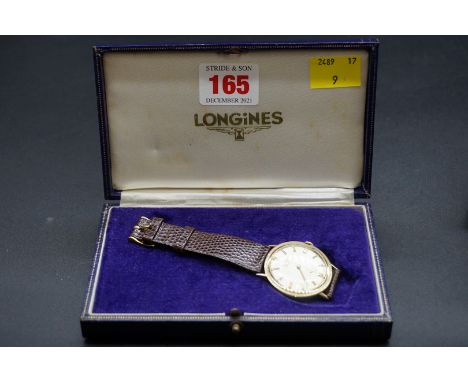 A vintage Longines 14k manual wind wristwatch,&nbsp;29mm,&nbsp;on Longines leather strap. 