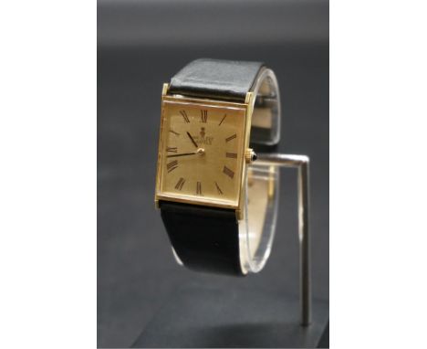 A Van Cleef &amp; Arpels Corum 18k gold manual wind wristwatch, 26mm, on black leather strap. 