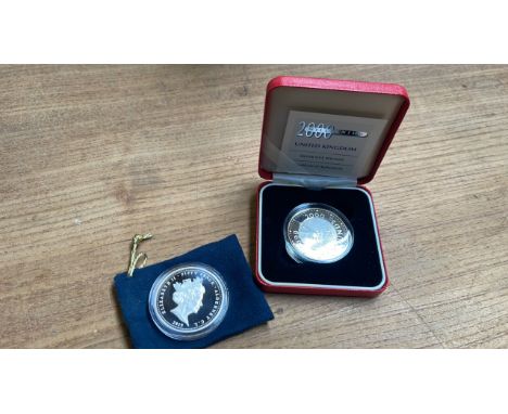  Sale Item:    2 SILVER COINS-1 1999-2000 £5- 1 2019 50P ELIZ. ALDERNEY  Vat Status:   No Vat   Buyers Premium:  This lot is 