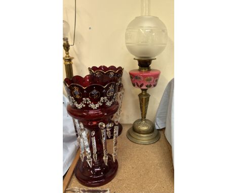 A Victorian opaque glass and brass oil lamp, decorated with flowers and leaves together with a pair of Victorian ruby glass t