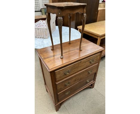 A walnut chest with a rectangular top above three drawers on bracket feet together with a small table 