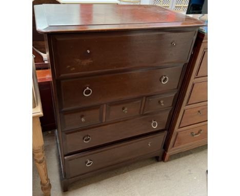 A Stag chest of drawers on bracket feet