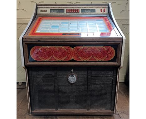 An early 1980s Rowe AMI jukebox, with recordsLights up but doesn't playView video