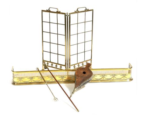 A late Victorian brass and bevelled glass folding fire screen, a brass Adam style fender, a pair of elm and leather bellows, 