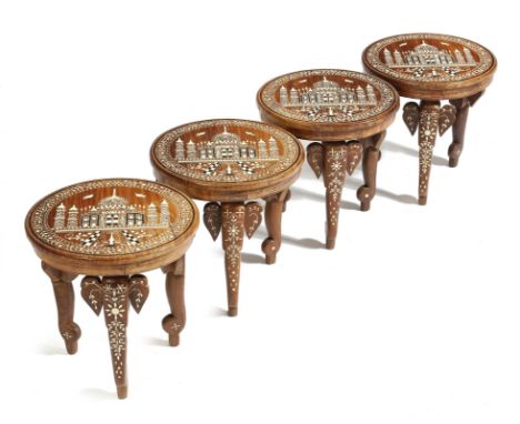 λ A matched set of four Indian rosewood occasional tables, each inlaid with bone and ivory with ebony stringing, the tops dec