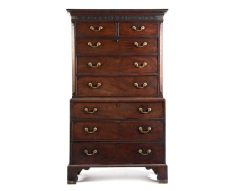 An early George III mahogany chest on chest, the blind fret frieze above two short and three long graduated drawers, the base