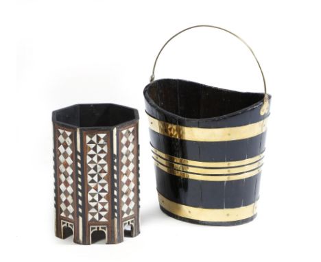 λ A 19th century stained wood and brass bound navette shaped peat bucket, with a swing handle, together with a Moorish mother