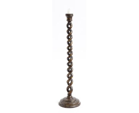 An aubergine lacquer spiral twist candlestick, with gilt decoration of flowers and leaves, 50cm high. Provenance: The collect
