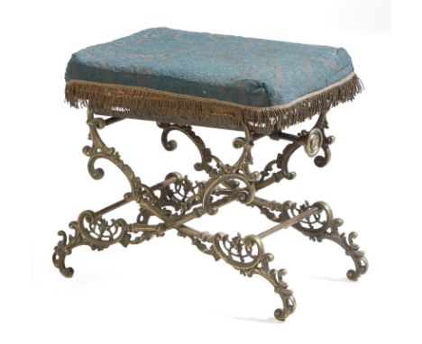 A Victorian cast brass adjustable stool, the upholstered seat on a leaf and scroll decorated frame, 37.4cm high, 54.6cm wide,