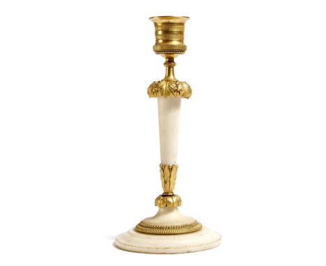 A Louis XVI white marble and ormolu candlestick, with an urn shape sconce, above a leaf decorated tapering stem, 20.8cm high.