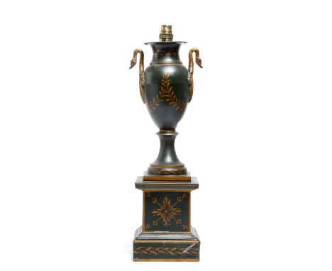 A tôle peinte table lamp in Empire style, with swan's head handles and decorated with laurel leaves, with shade, 46.8cm high 