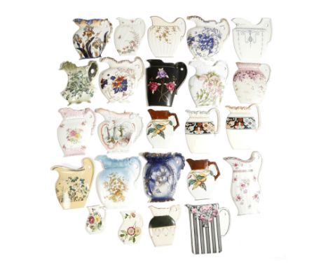 AMENDED A collection of late Victorian pottery wall mounted jug samples, some with maker's marks, including: S.M. & Co., Wilk