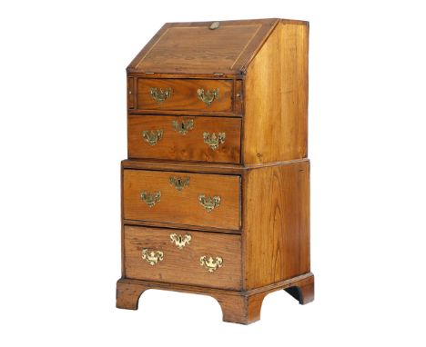 A small 18th century elm bureau, in two halves, the crossbanded fall revealing pigeon holes and a crossbanded cupboard, above
