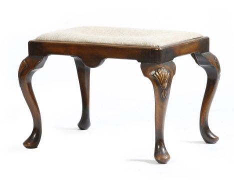 A walnut stool in George II style, with a drop-in needlework seat, on shell capped cabriole legs, early 20th century, 46cm hi