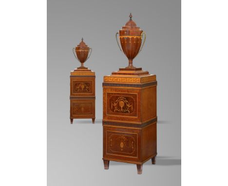 A pair of George III and later mahogany and satinwood cutlery urns on pedestals, inlaid with boxwood stringing and with marqu