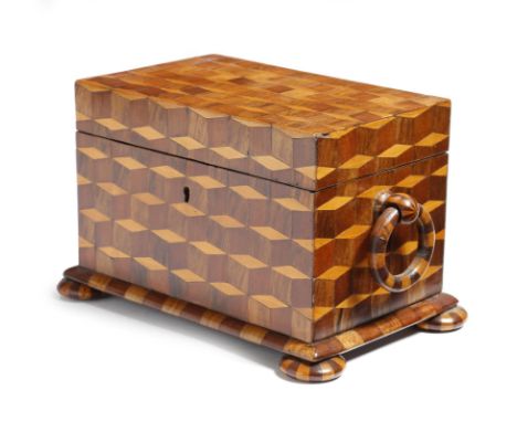 λ An early 19th century cube parquetry tea caddy, inlaid with rosewood, birch and mahogany, the interior with a pair of lidde
