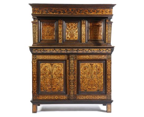 An oak and fruitwood marquetry court cupboard, inlaid with strapwork and urns of flowers, with a pair of cupboards, the base 