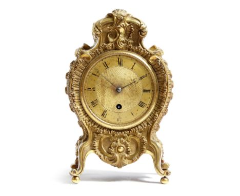 An early 19th century ormolu mantel timepiece, with a single fusée movement, the circular dial with Roman numerals and an eng