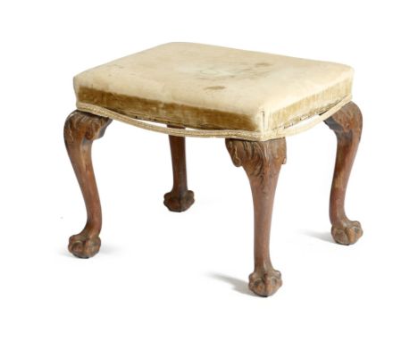 A George II mahogany stool, the stuffed-over seat on acanthus carved cabriole legs and claw and ball feet, 46.5cm high, 57.5c