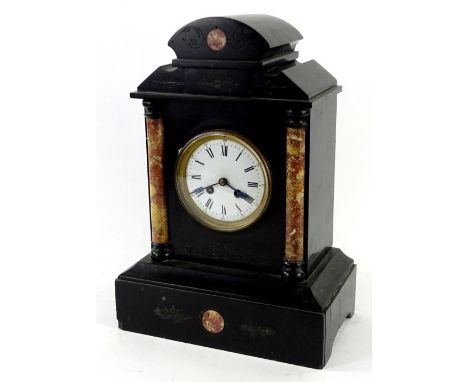 A French black slate and marble portico type mantel clock, the shaped top above two cylindrical pilasters, flanking a white e