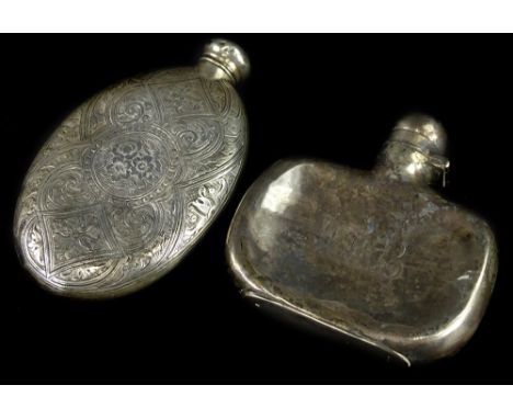 A Victorian silver oval hip flask, decorated with scrolls etc., Birmingham 1860 and another hip flask (AF), 4¼oz.