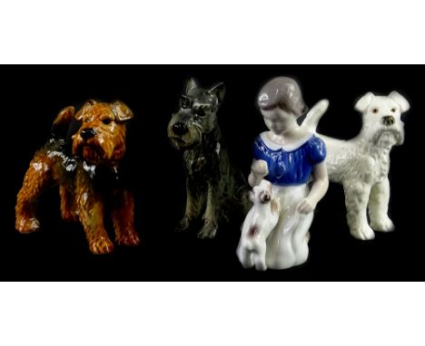 A collection of ceramics, to include three Goebel Terriers, and a Bing &amp; Grondahl figure of a girl with a Terrier. (4)