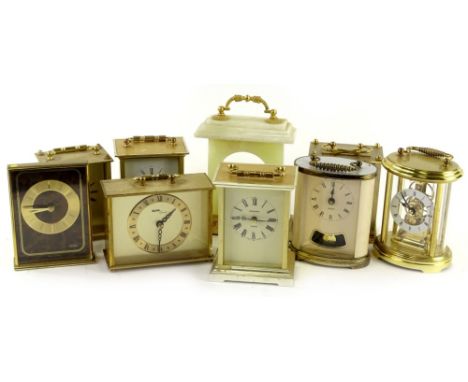 Various brass and brass effect carriage type clocks, to include Estyma, President, Avia, an onyx clock case and two oval carr