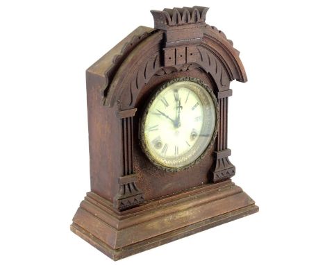 An American mantel clock, in a walnut case, the dial with Roman numerals by the Ansonia Clock Company, 36cm H.