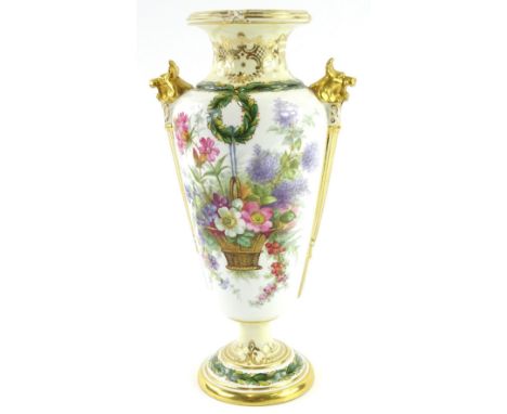 A Spode Copeland porcelain two handled vase, painted with a basket of flowers, reads etc., stylised gilt lion mask handles, p