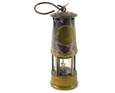 A Protector oil lamp, numbered 1130 and with a Linby Colliery label.