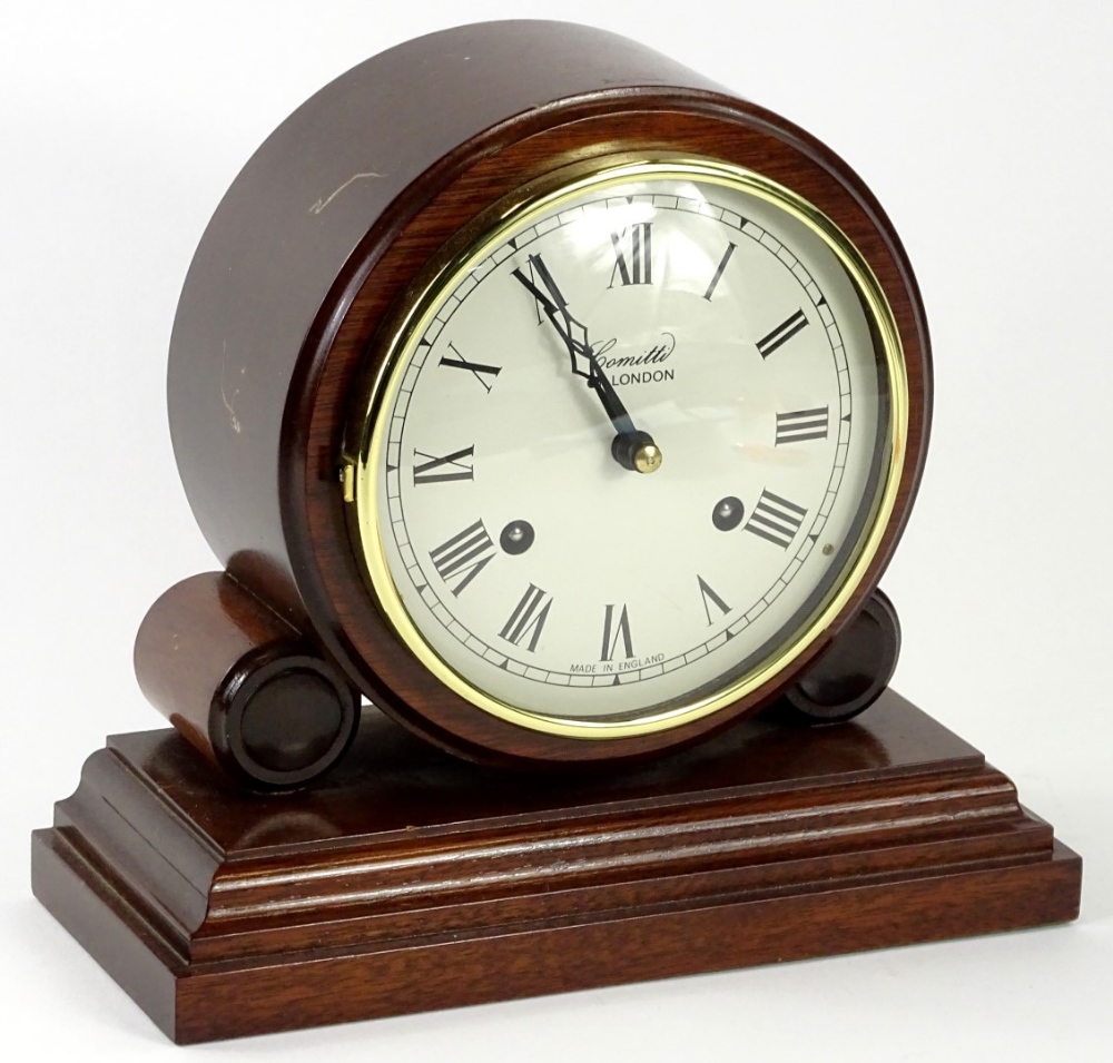 A modern mahogany mantel clock by Comitti of London, on a rectangular