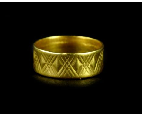 A 22ct gold wedding band, with crosshatch engraving, ring size O½, 6g.