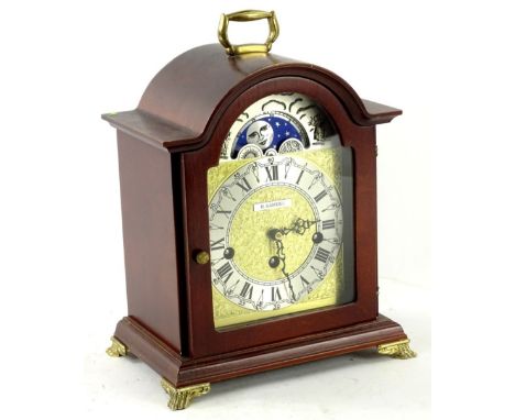 A mahogany case German mantel clock in George III style, the arched dial stamped H Samuel, 30cm H.Provenance: This timepiece 