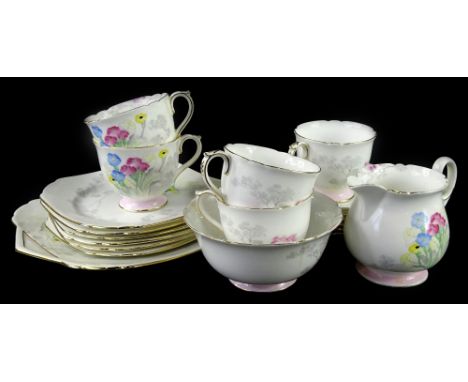 A Shelley part tea service, decorated with Art Deco style flowers, trees etc., pattern number 12812, some pieces (AF)