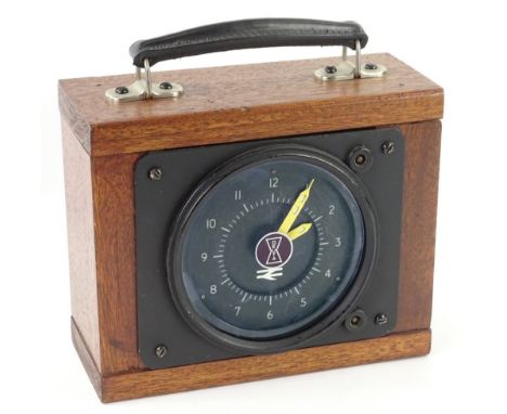 A British Rail locomotive clock, with blackened dial, stamped Deuta, possibly intercity, in later mahogany travelling case, 2