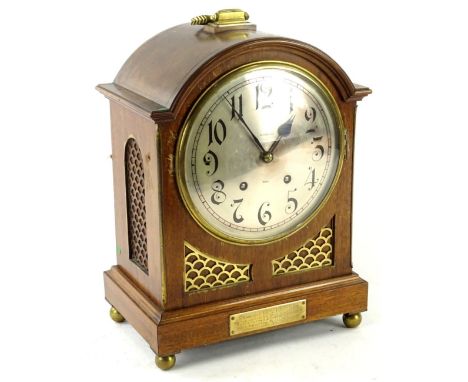 An Edwardian mahogany and brass mantel clock in George III style, the silvered dial stamped King &amp; Co Ltd Hull, with pres