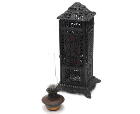 A late 19thC pierced cast iron floor lamp, named Rippingilles, Albion Lamp Company, decorated overall with rococo scrolls, pi