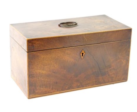 A George III mahogany tea caddy, with a rectangular hinged lid, enclosing two separate tea containers and a recess for a bowl