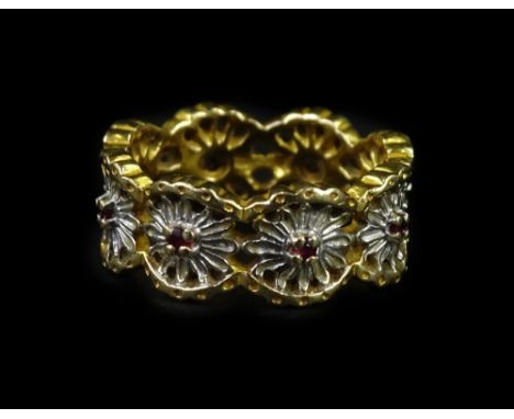 A dress ring, with sunburst design links, each with central small ruby in claw setting, white and yellow metal, stamped 585 r