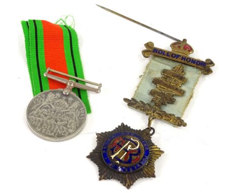 A Masonic jewel, awarded to a Brother Frederick R West of Fitzroy Lodge 6132 and a Second World War Defence medal. (2)