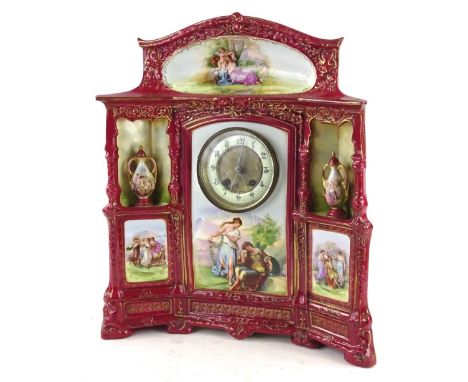 A late 19th/early 20thC Continental porcelain mantel clock, decorated overall with printed panels in the manner of Angelica K