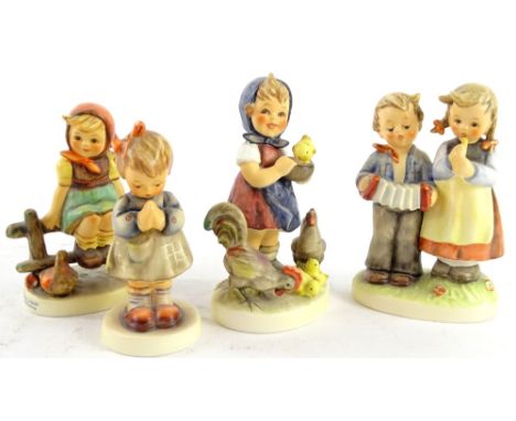 Four Goebel Hummel figures of children, to include a musician group and a chicken group, the largest 12cm H.