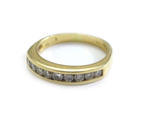An 18ct gold half hoop diamond eternity ring, set with nine round brilliant cut diamonds, marked to band .5cts, each in tensi
