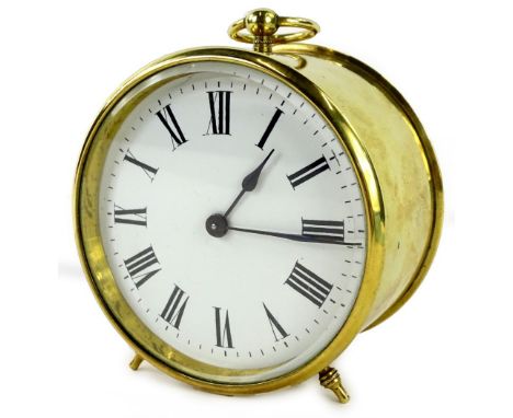 A late 19th/early 20thC French brass travelling clock, with a circular case, the white enamel dial with Roman numerals, unmar
