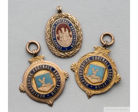 Two 9ct gold and enamel Hertfordshire FA football winners medals,&nbsp;
the first inscribed Herts. County Cup 1922-23, the ot