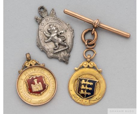 Three football medals, from 1905 to late 1920s,&nbsp;
comprising silver medal the obverse inscribed A.G. BRAND, the reverse i