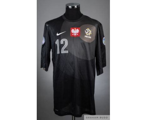 Wojciech Szcesny Black Poland no.12 jersey from the 2014 World Cup Qualifiers,
Player issued long sleeved jersey that has had